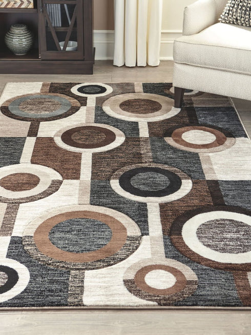 Guintte Black/Brown/Cream Medium Rug - WCC Furniture & Mattress Center Lafayette & Lake Charles