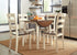 Woodanville White/Brown 5 Piece Round Drop Leaf Dining Set - WCC Furniture & Mattress Center Lafayette & Lake Charles